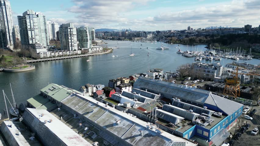 Granville Island in vancouver drone aerial on sunny day and granville bridge