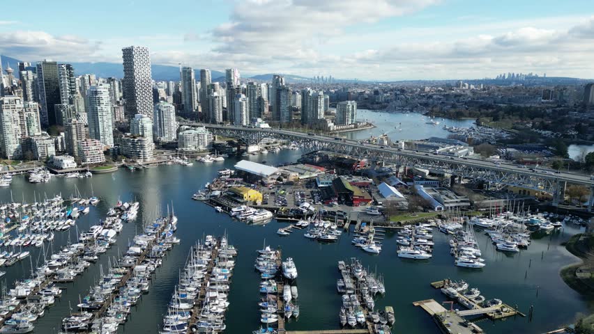 Granville Island in vancouver drone aerial on sunny day and granville bridge