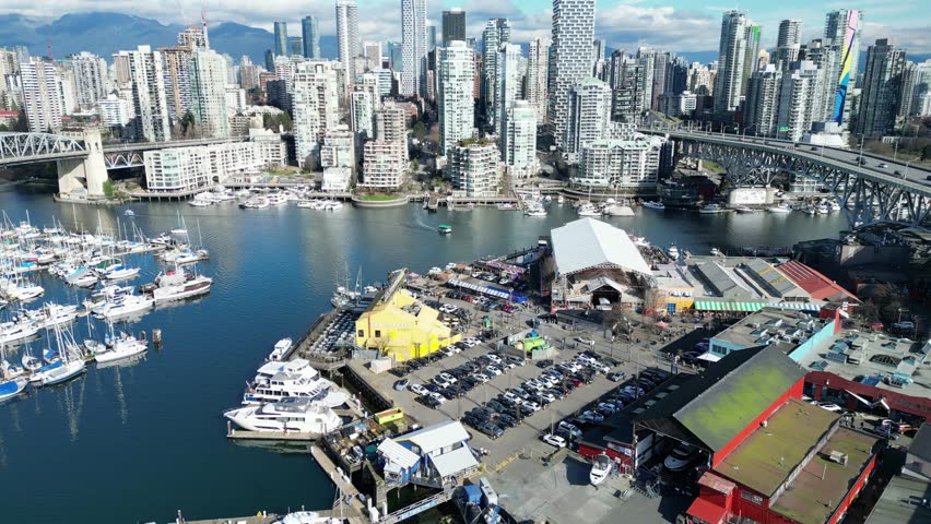 Granville Island in vancouver drone aerial on sunny day and granville bridge