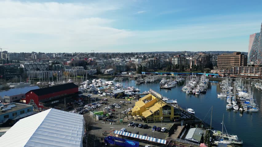 Granville Island in vancouver drone aerial on sunny day and granville bridge