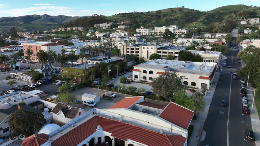 Ventura, California, USA - Aerial View of Historic Downtown Ventura Along Highway 101 Showing Hotels, Retail Stores, Commercial Buildings, and Rolling Hills in SoCal