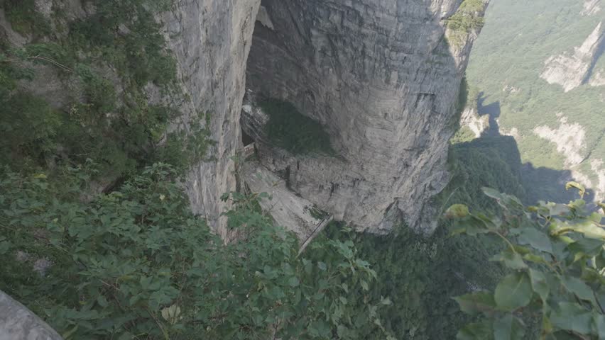 Cliffs revealing, high angle Tianmen Mountain Zhangjiajie China Dramatic Forest Valley Landscape