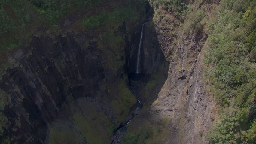 aerial view of a Remote waterfall with a 360 turn around.