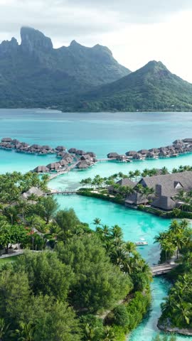 Vertical Drone Shot of Bora Bora Island and Luxury Tropical Resort With Bungalows Over Water