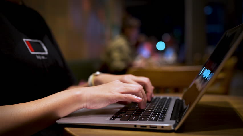 Close up of hands typing on laptop keyboard with SEO and AI chatbot interface, digital marketing optimization and data analysis concept for business growth.