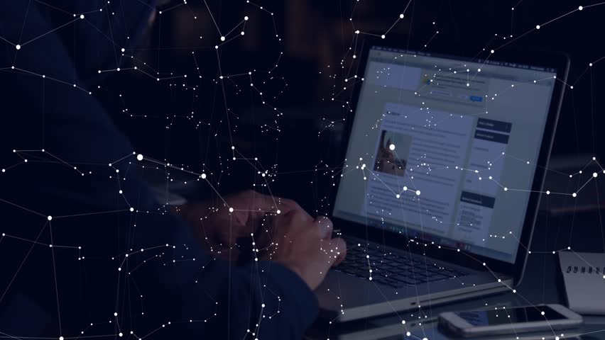 Man reacting to UI updates, typing while overlays highlighting keyboard and updating charts. Laptop, networks, visualization, analytics, desk, notebook, focus
