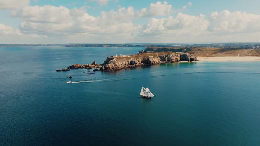 aerial view of sailing ship near Pointe du Toulinguet coastline in Brittany, France