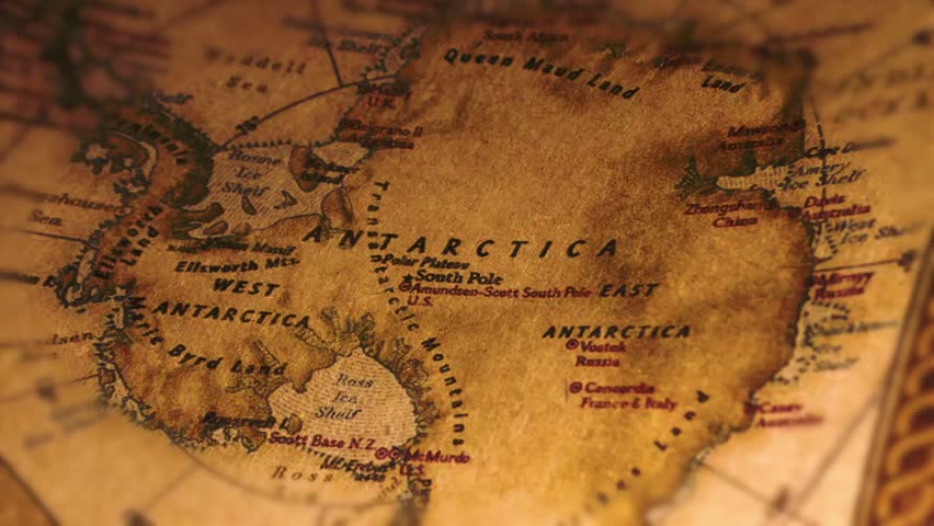 A stunning macro shot captures a meticulously detailed antique map of Antarctica. The aged parchment texture, with its warm brown tones and subtle imperfections, evokes a sense of exploration and historical discovery. The map reveals intricate geographical markings, highlighting the West and East coasts, alongside key landmarks like Queen Maud Land, Ross Ice Shelf, and the South Pole. This captivating image offers a glimpse into a bygone era of polar exploration, perfect for use in travel, geography, historical, or educational contexts. Ideal for creating cinematic content or adding a touch of vintage sophistication to projects. A vibrant and authentic visual asset.