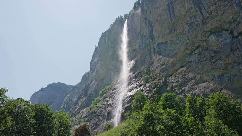 Staubbach Falls Cascading Down Cliff in Lauterbrunnen, Switzerland