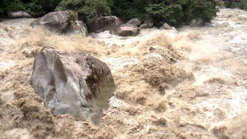 Scenic dramatic view with the powerful waters of Urubamba River crossing the Sacred Valley in Aguas Calientes