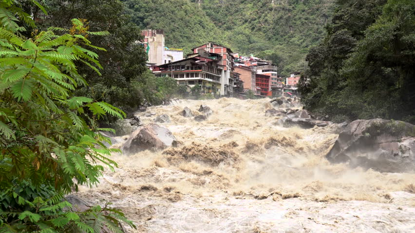 Scenic dramatic view with the powerful waters of Urubamba River crossing the Sacred Valley in Aguas Calientes