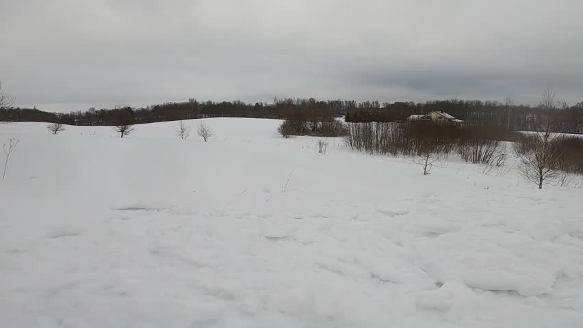 Winter landscape with snow-covered hills. Scenic natural environment during cold season with heavy snowfall.
