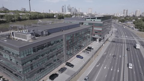 Drone Orbiting Business Center above Highway