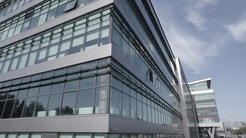 Drone Rising beside Modern Glass Business Center