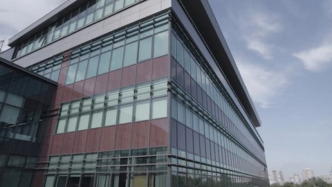 Ascending Drone Shot near Glass Office Building