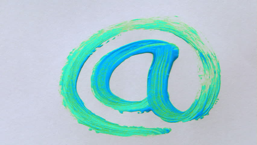 Paintbrush painting a color email symbol on white paper
