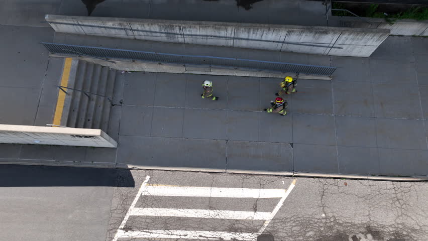 Firefighters entering a building top down view
