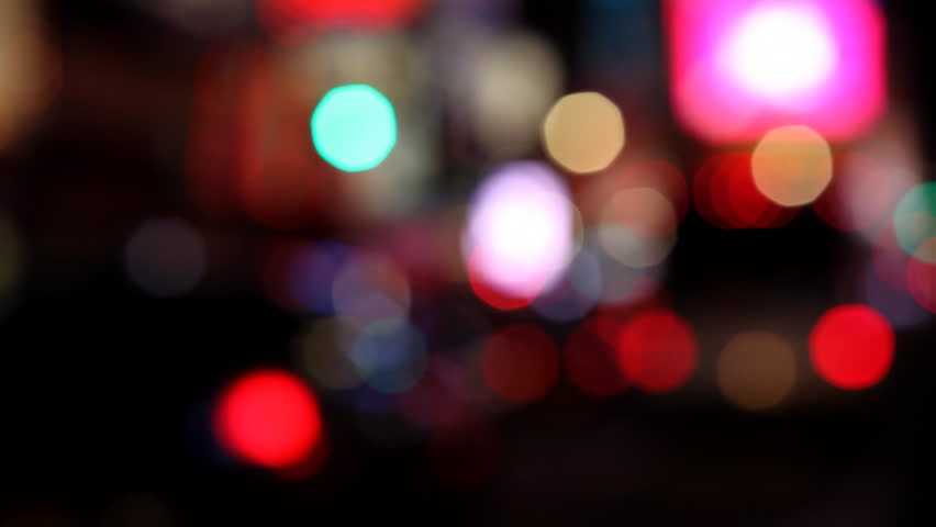 Colorful out of focus lights of city traffic, ideal for titles and intros /