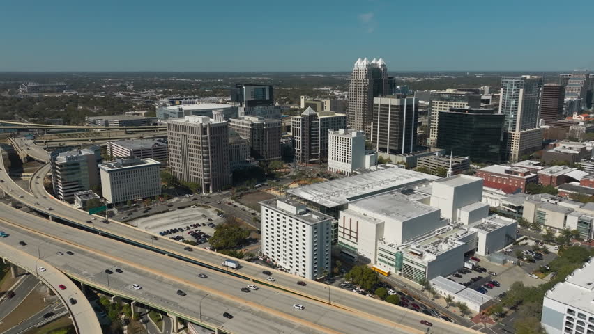 A bright, high-altitude perspective reveals the dynamic architecture and expanding skyline that define downtown Orlando.