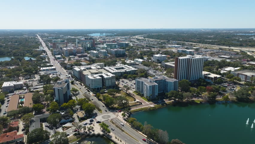 A bright, high-altitude perspective reveals the dynamic architecture on the other side of downtown Orlando