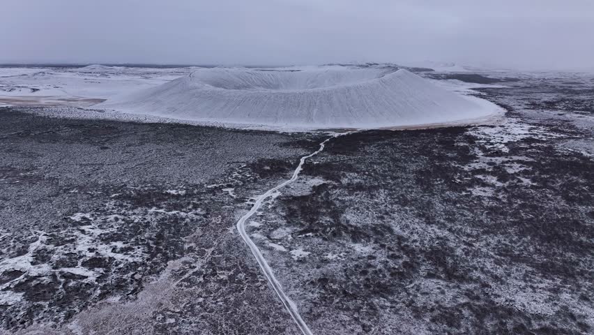 Dramatic View Of Snow-dusted Hverfjall Caldera In Winter, Iceland. Aerial Shot
