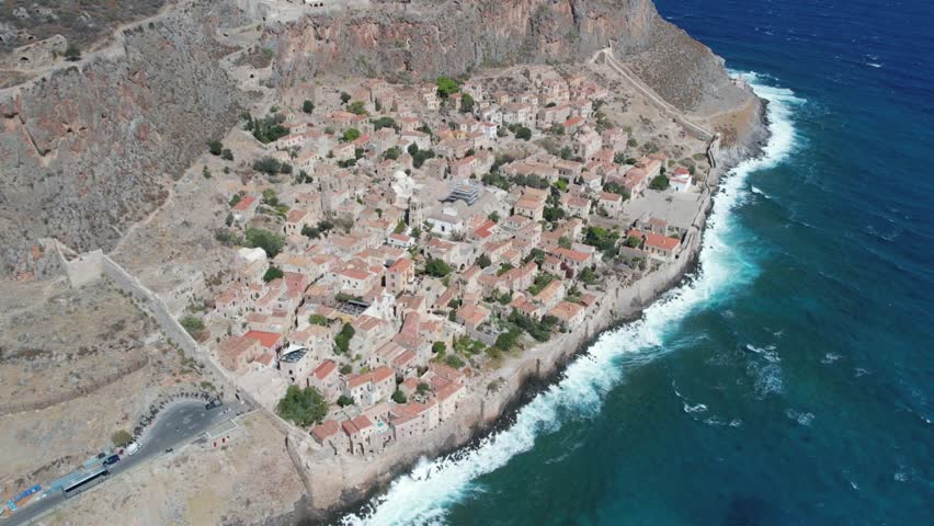 Stone Seaside Village on Cliff with Medieval Walls and Waves