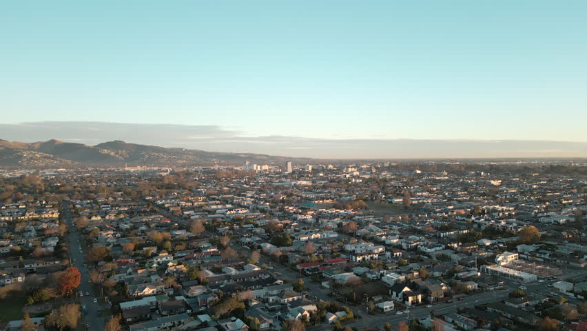 Christchurch City Clear Winter Morning New Zealand Drone Track Over Suburbs Towards Center 4K 30FPS