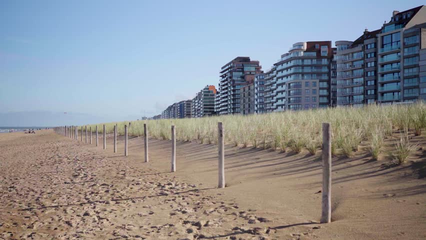 Beach front houses with dune grass and wood fence in Knokke Belgium