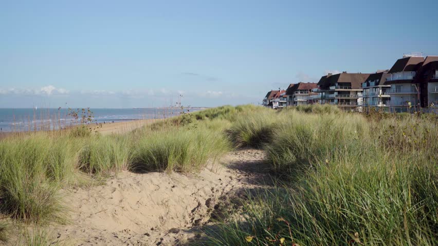 Dune with Grass and beach front houses at atlantic ocean in Knokke Belgium