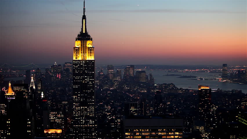Yellow illuminated skyscraper at dusk in Manhattan, New York City / HD1080 /