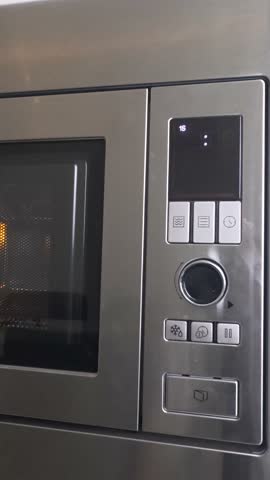 Microwave metallic display.Microwave control panel .High quality 4k footage