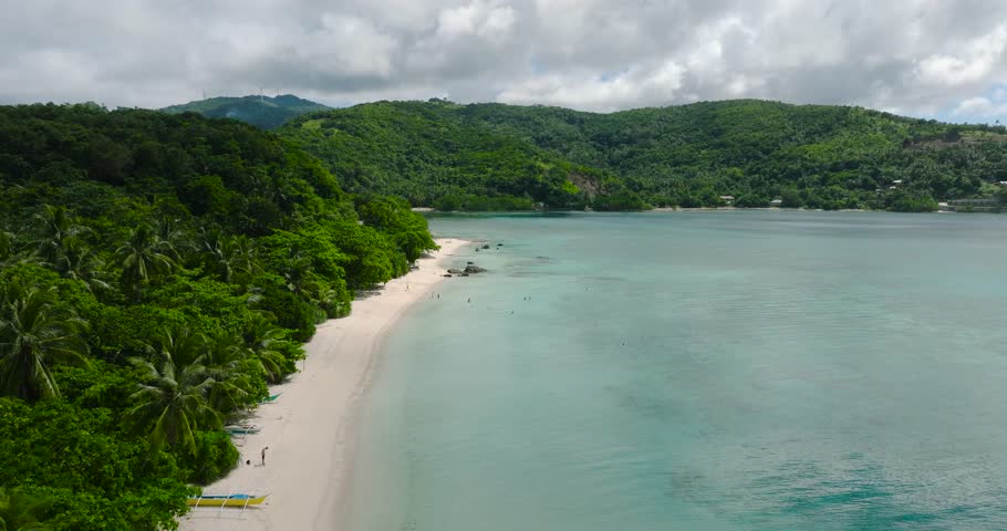 Tiamban Beach and Nonok Beach Resort with white sand and clear sea water. Romblon Island. Romblon, Philippines.