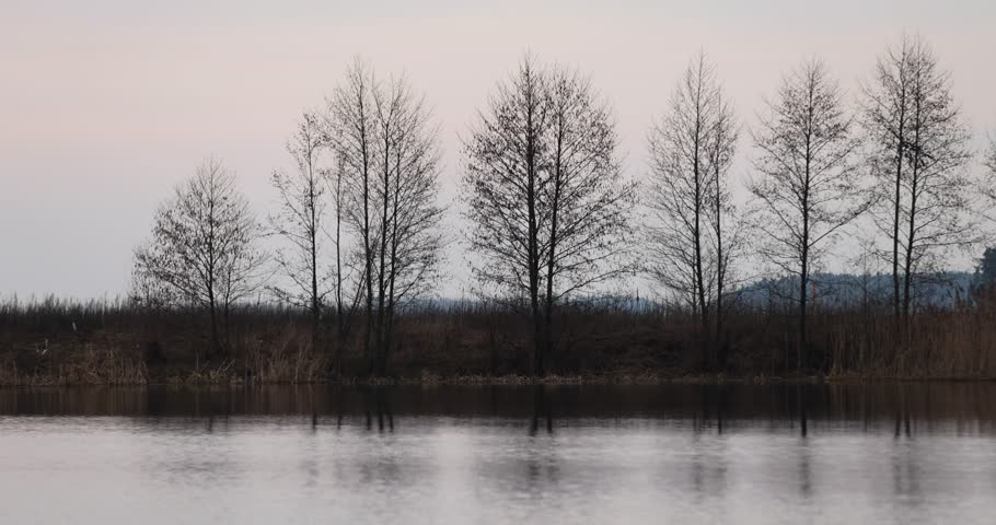 blue-gray clouds on the lake at sunset, a beautiful reflection of the sky and clouds in the lake at sunset