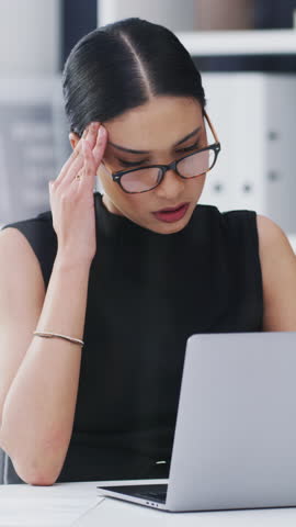 Woman, headache and glasses in office with laptop, wrong eyewear prescription or marketing crisis. Tired, person and computer in workplace with migraine, spectacles or stress for advertising project.