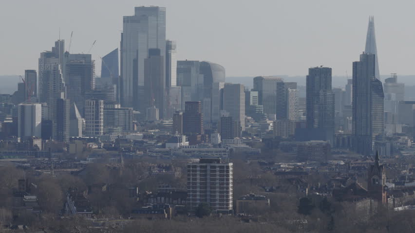 Aerial view of the London skyline in the distance on bright day