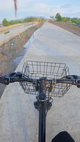 Bicycle Ride on a Concrete Path