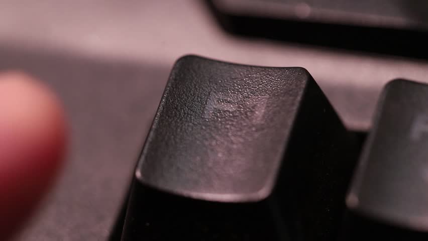 Pressing F1 button for help and support on computer keyboard, macro shot of human finger.
