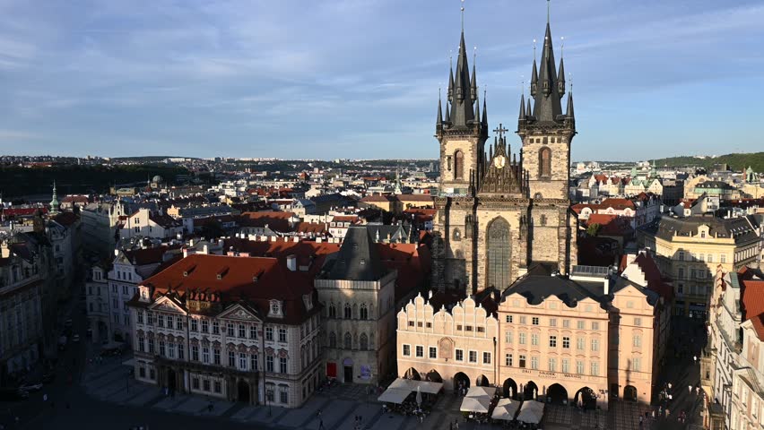 PRAGUE, CZECH REPUBLIC - JULY 2025: City Center Life and Architecture. A vibrant street scene in the heart of Prague, Czech Republic. The footage captures the daily life of locals and tourists walking through historic streets, featuring iconic landmarks, red trams, and the beautiful Gothic and Baroque architecture of the old town. Ideal for travel vlogs, European city documentaries, and lifestyle content
