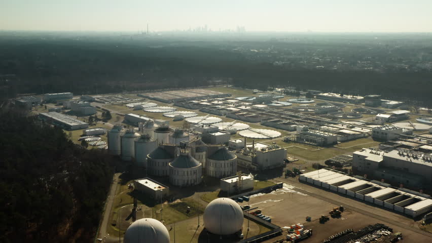 Urban water filtration complex processes liquid waste for the capital city. Massive municipal infrastructure manages sewage treatment and sanitation to support metropolitan ecology.
