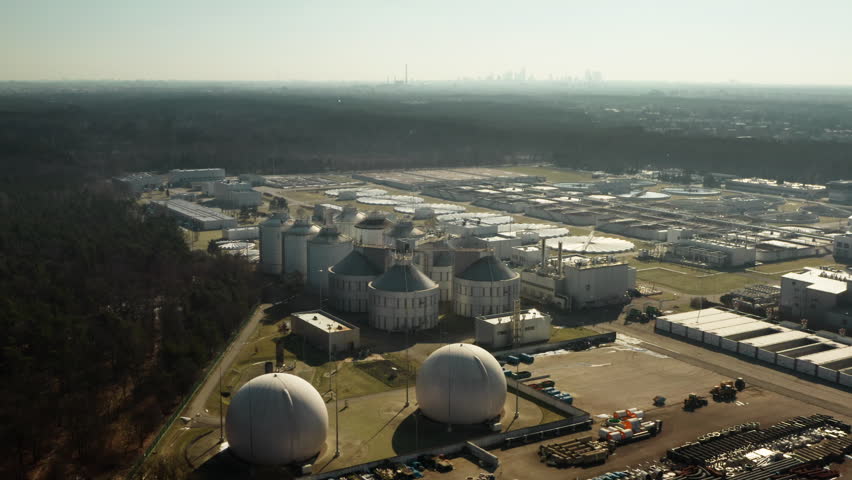 Regional utility infrastructure purifies wastewater for the metropolitan area. Large municipal plant processes urban sewage and liquid pollution to support capital city sanitation systems.