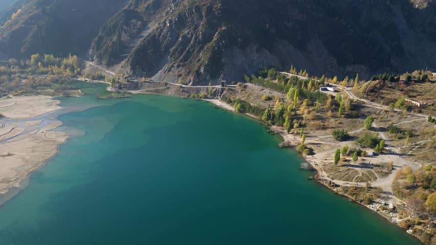 Almaty, Almaty Region, Kazakhstan.
October 11, 2025.
Aerial view of a mountain lake with vibrant colors. Lake Issyk in autumn.