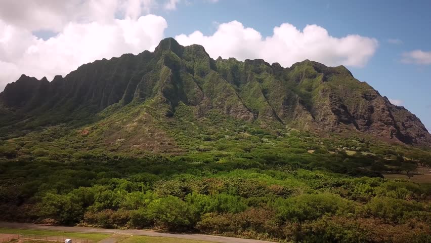 Hawaiian Mountains at Kualoa Ranch, Oahu, drone footage, Hawaii. Majestic green mountains. Filming location in Hawaii. High quality 4k footage