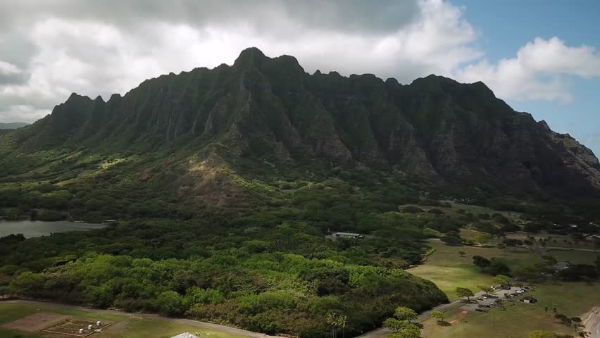 Hawaiian Mountains at Kualoa Ranch, Oahu, drone footage, Hawaii. Majestic green mountains. Filming location in Hawaii. High quality 4k footage