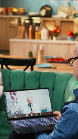 Vertical Video Senior people on teleconsultation with medic asking about pills, using laptop at home. Virtual checkup with medical advice and treatment planning, remote aid and safe in-home care.