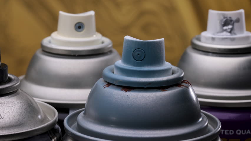  Various Spray Paint Can Nozzles and Colours Close Up Right to Left
