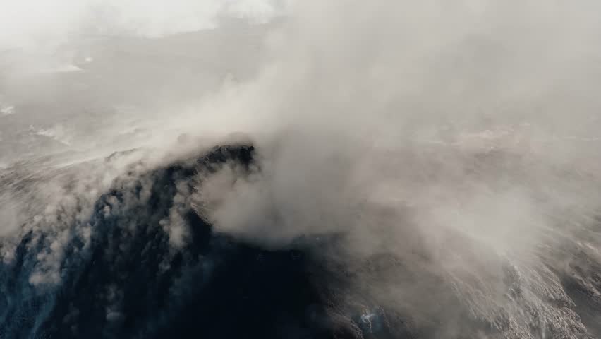 Aerial view of dense ash plume over Fuego volcano crater in Guatemala