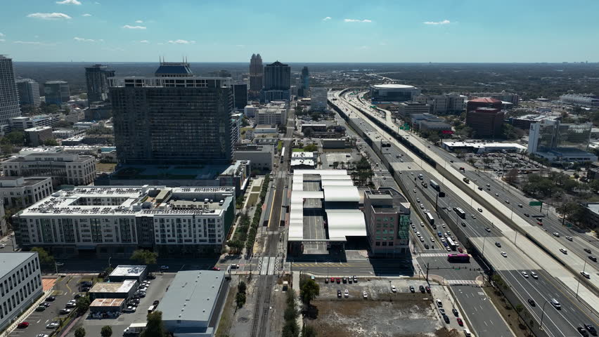 Symmetrical panning drone clip over I-4 in downtown Orlando, FL.