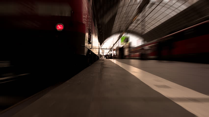 Man runs after disembarking train from low view of point and radial blur effect