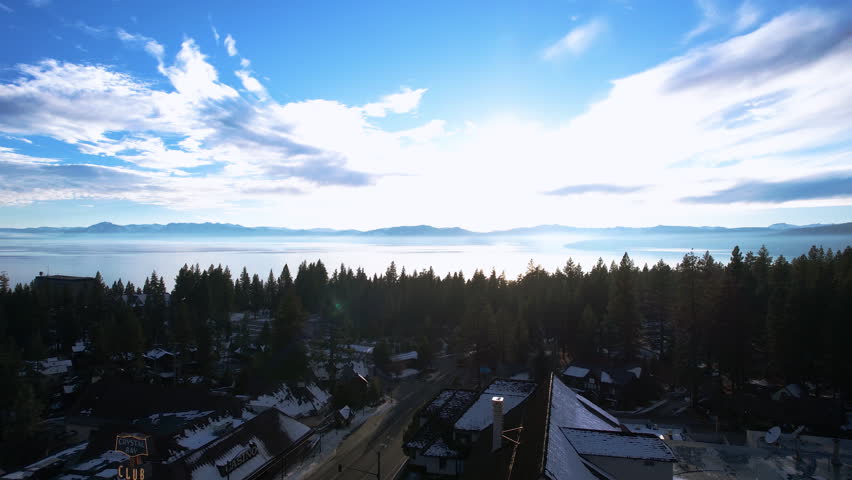Aerial View of Lake Tahoe and Crystal Bay, Traffic on State Border Between Nevada and California on Sunny Winter Evening