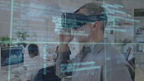 Mature man raising vr headset and viewing code overlay in office, detecting phishing threat visuals. Virtual reality, cybersecurity, digital interface, office technology, data visualization - Powered by Shutterstock - Get 15% off with code: PIKWIZARD15